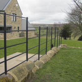 Wall top estate fencing