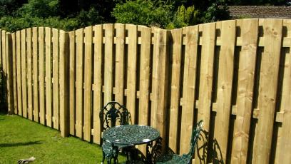 Hit and miss fencing giving an effect of a full boarded fence preventing any site in or out of the garden, but at the same time allowing wind to pass through the fence.  