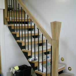 Bespoke wrought iron and oak stair rail