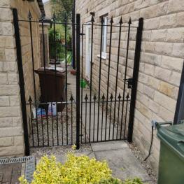 Wrought iron hand gate with arrows